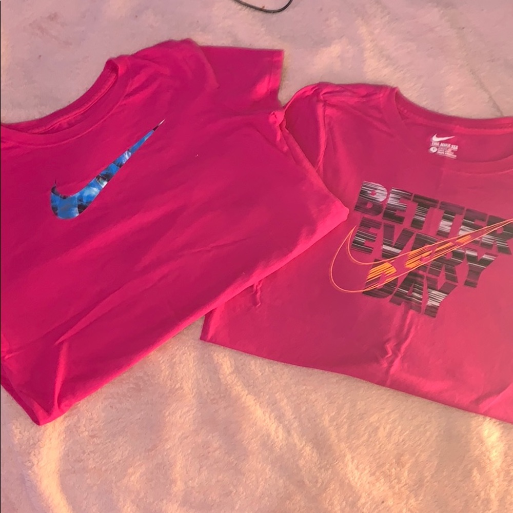 2 pink nike shirts